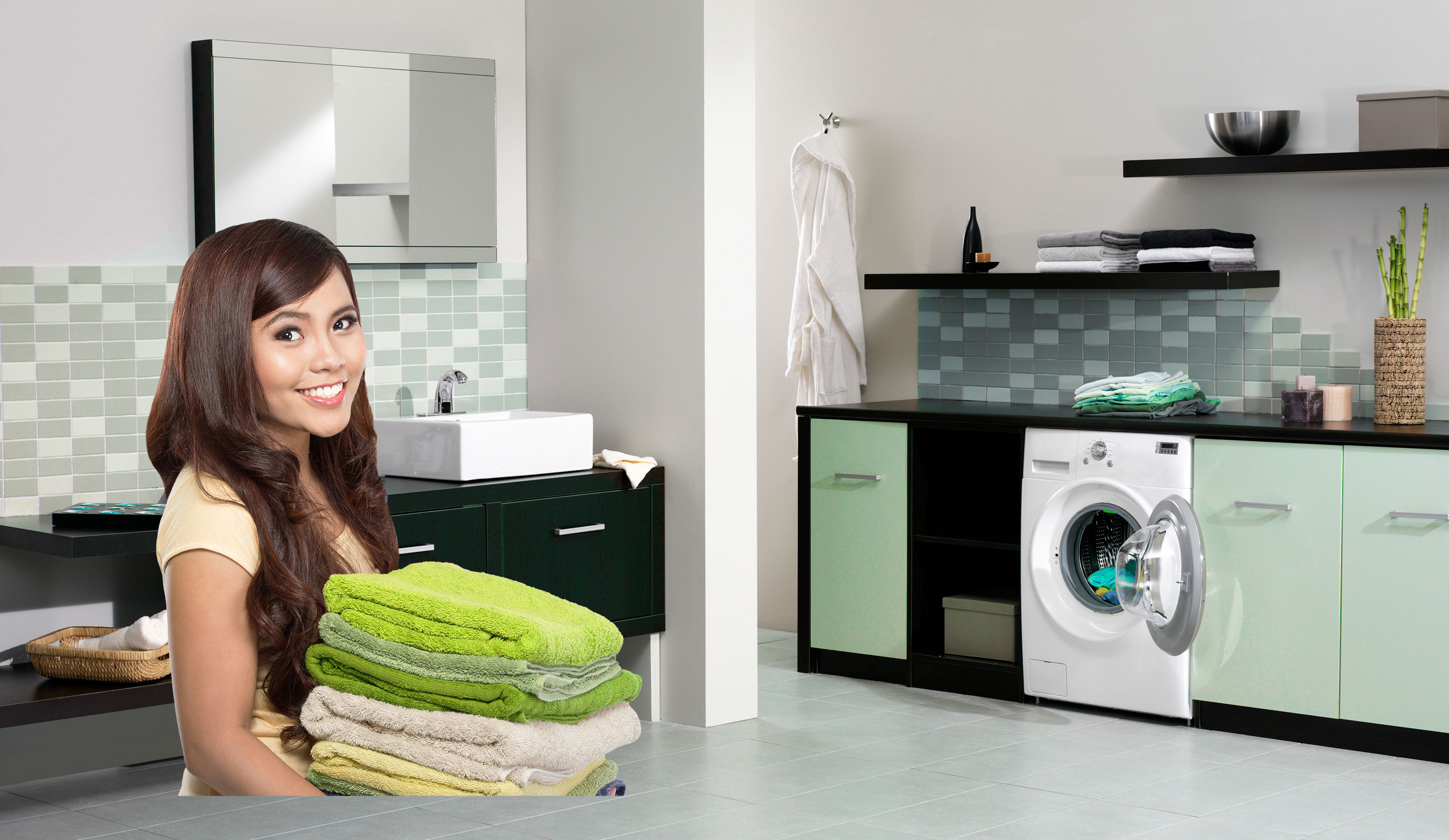 woman with folded towels for washing machine